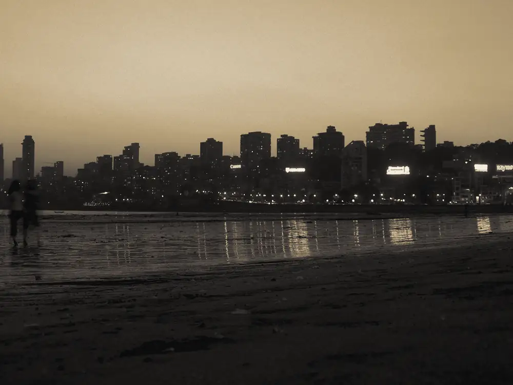 The Mumbai skyline at dusk, seen across the water