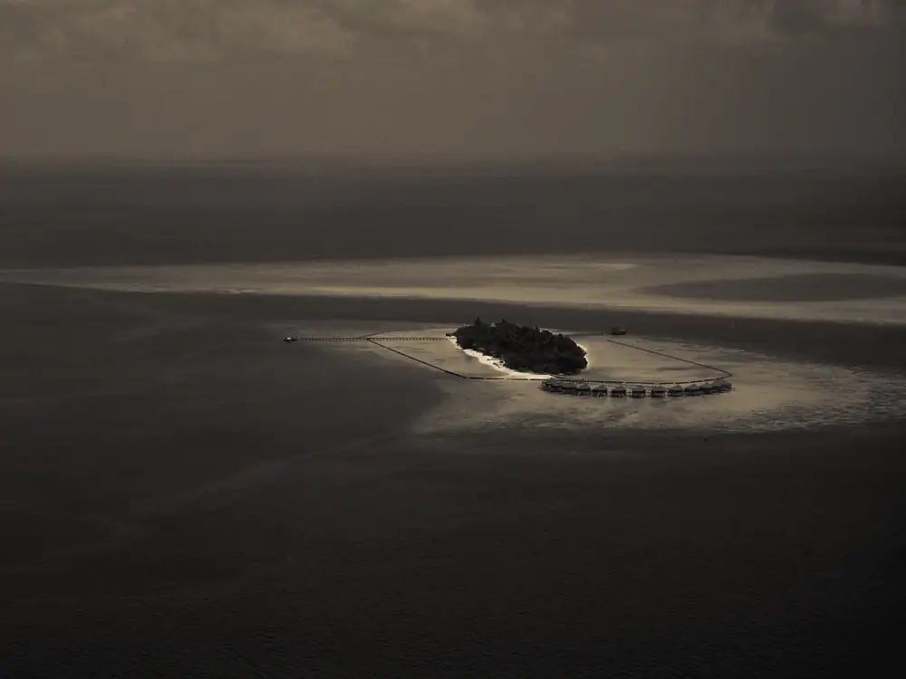 An island and its reef in Lhaviyani Atoll, the Maldives, seen from the air